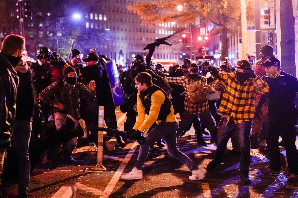 Members of the far-right group Proud Boys clash with counterprotesters in downtown Washington, D.C., on Dec. 12, 2020. (Photo: Erin Scott / Reuters)