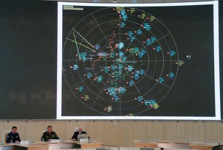 Spokesman for the Russian Defence Ministry, Major-General Igor Konashenkov (C) delivers a news conference dedicated to the crash of the Malaysia Airlines Boeing 777 plane operating flight MH17, in Moscow, Russia, September 26, 2016. REUTERS/Maxim Zmeyev