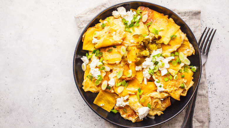 migas with green onions and crumbled cheese