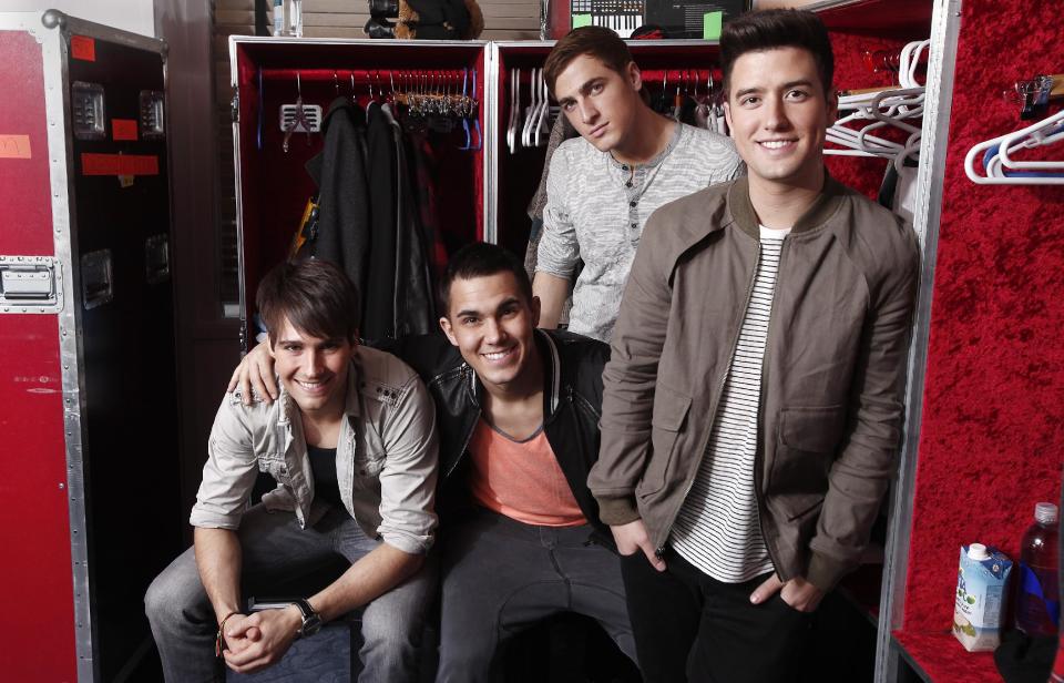 In this March 9, 2012 image, the boy band Big Time Rush, from left, James Maslow, Carlos Pena Jr., Kendall Schmidt and Logan Henderson, pose for a portrait in their dressing room at Radio City Music Hall in New York. Big Time Rush, who star on their own Nickelodeon TV show, is one of many boy bands who have recently emerged on the music scene since *NSYNC and Backstreet Boys dominated pop music in the 1990s. (AP Photo/Carlo Allegri)