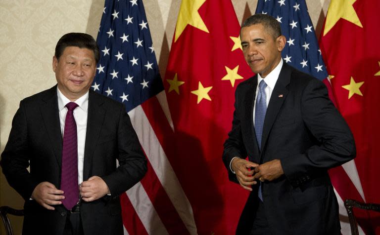 US President Barack Obama and Chinese President Xi Jinping (L) meet at the US ambassador's residence in The Hague on March 24, 2014 on the sidelines of the Nuclear Security Summit