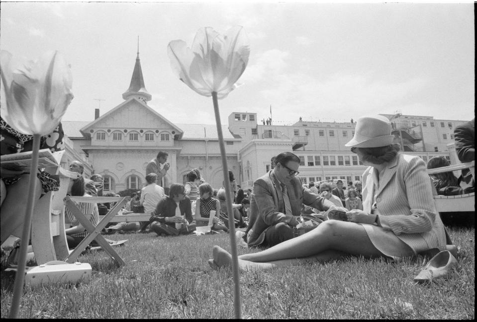 A couple look over programs in the paddock area of Churchill Downs. May 1, 1971