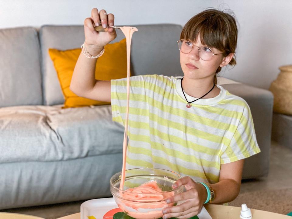 teenage girl preparing slime at home fun activities for kids