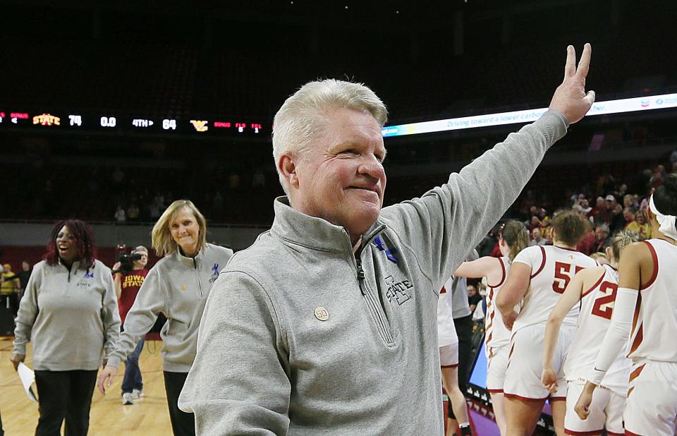 Iowa State coach Bill Fennelly signals "victory" after the Cyclones beat West Virginia on Wednesday at Hilton Coliseum in Ames.
