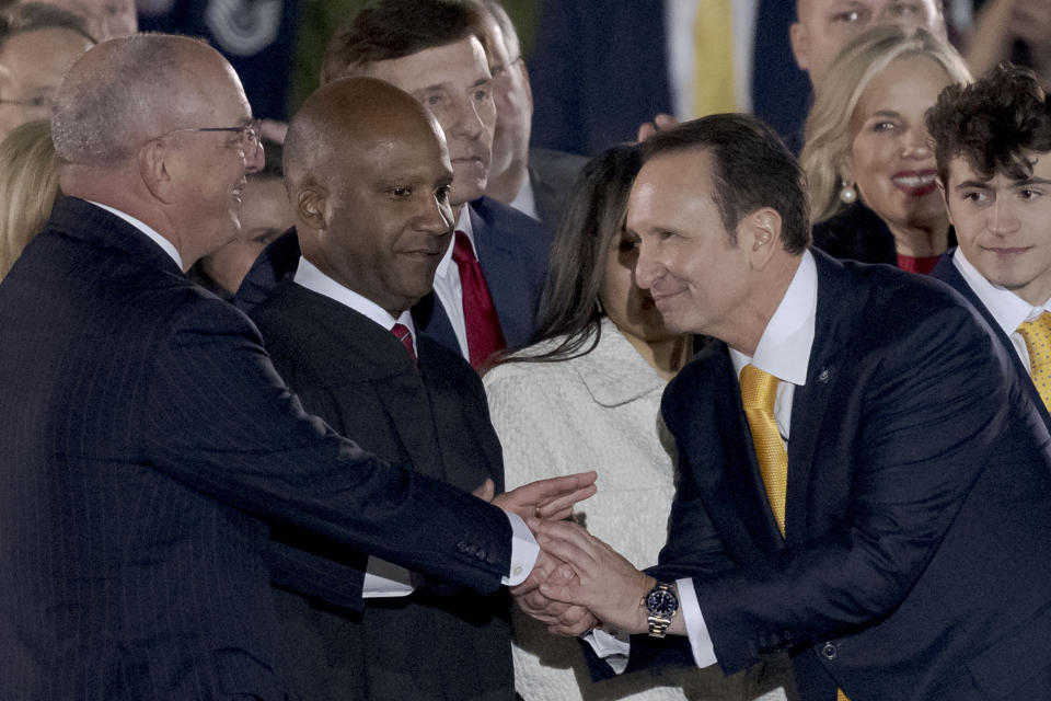 Louisiana Gov. John Bel Edwards, left, shakes hands with Republican Gov.-elect Jeff Landry after he was sworn in at his inauguration ceremony at the State Capitol building in Baton Rouge, La., Sunday, Jan. 7, 2024. The inauguration, originally scheduled for Monday, was pushed up a day early due to weather concerns. (AP Photo/Matthew Hinton)