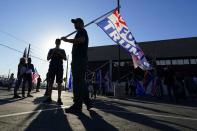 Supporters of President Donald Trump rally outside the Maricopa County Elections Department as the agency conducts a post-election logic and accuracy test for the general election Wednesday, Nov. 18, 2020, in Phoenix. (AP Photo/Ross D. Franklin)