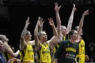 Australian players cheer from the bench during their bronze medal game against Canada at the women's Basketball World Cup in Sydney, Australia, Saturday, Oct. 1, 2022. (AP Photo/Rick Rycroft)