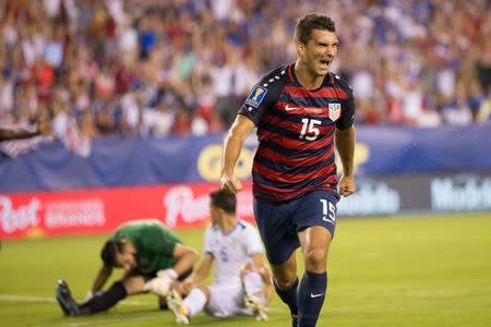 Jul 19, 2017; Philadelphia, PA, USA; United States defender Eric Lichaj (15) celebrates after scoring a goal past El Salvador goalkeeper Derby Carrillo (18) and defender Ivan Mancia (5) during the first half at Lincoln Financial Field. Mandatory Credit: Bill Streicher-USA TODAY Sports