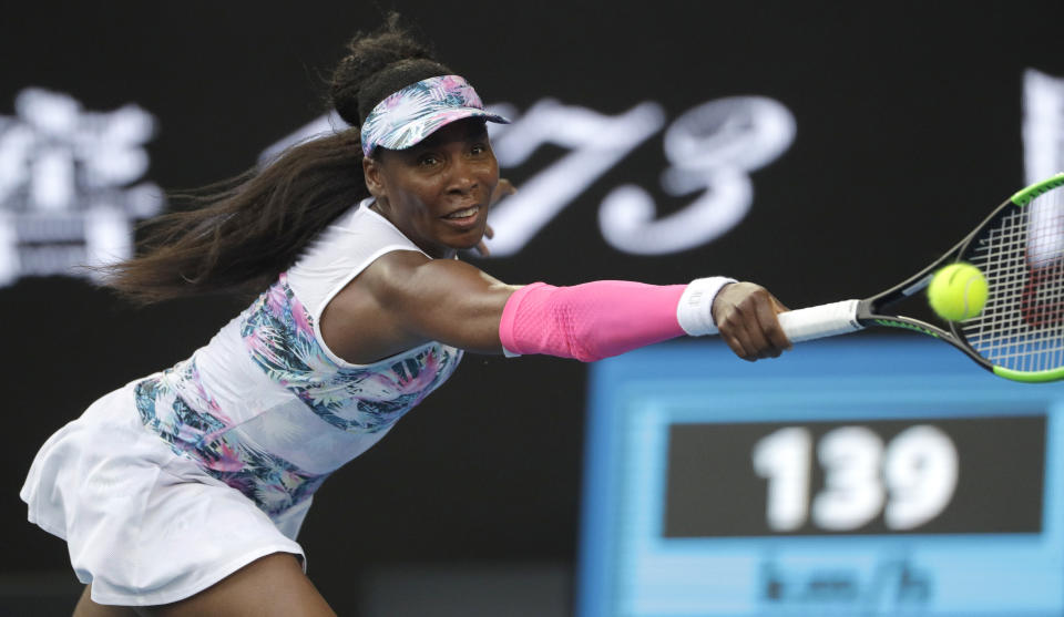 United States' Venus Williams reaches for a backhand return to Romania's Mihaela Buzarnescu during their first round match at the Australian Open tennis championships in Melbourne, Australia, Tuesday, Jan. 15, 2019. (AP Photo/Mark Schiefelbein)