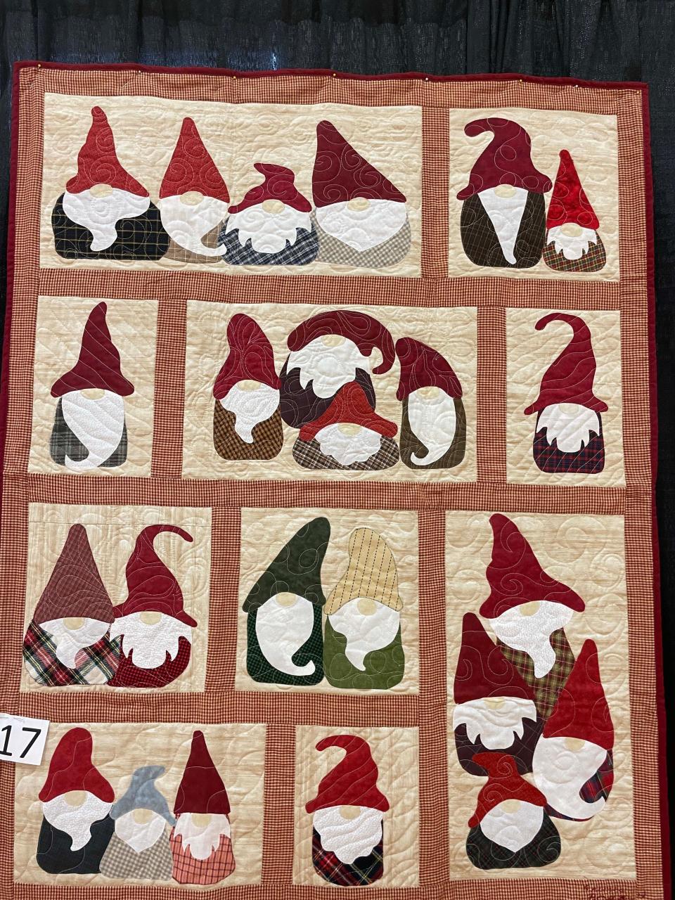 Gnomes are all the rage in decorating. “Gnomes on the Go” was quilted by Dottie Godolphin.