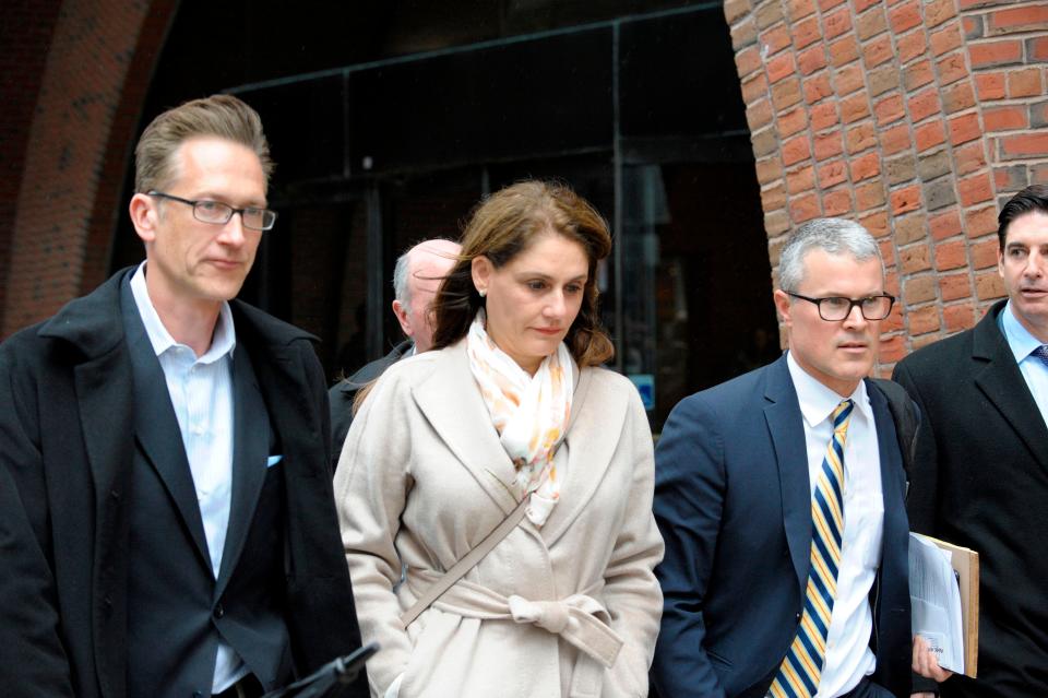 Michelle Janavs, former executive of a food manufacturer, makes her way out of the courthouse after giving her plea in front of a judge for charges in the college admissions scandal at the John Joseph Moakley United States Courthouse in Boston on March 29, 2019. 