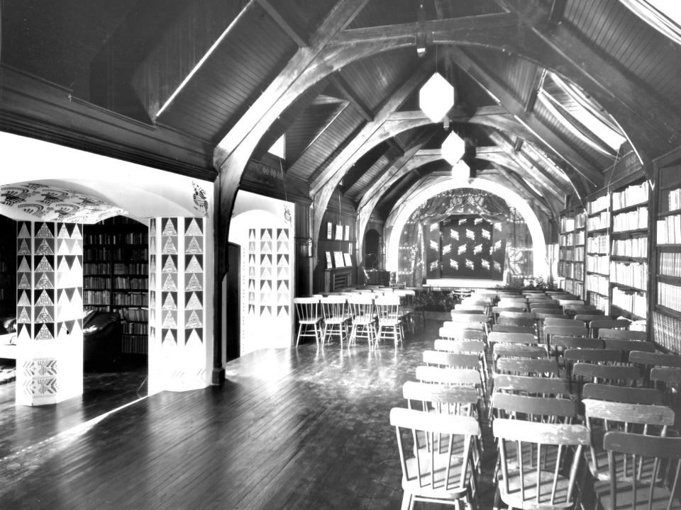 Empty chairs face a stage inside the Garrett family’s home theater in Baltimore in 1923.