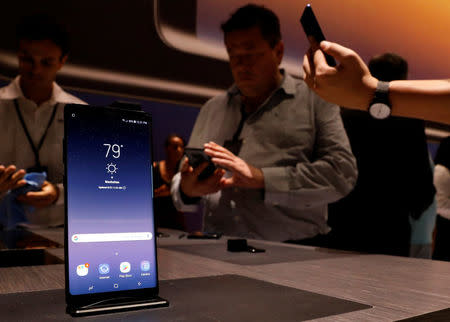 Guests use the new Galaxy Note 8 smartphone during the company's launch event in New York City, U.S., August 23, 2017. REUTERS/Brendan McDermid