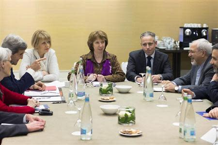 U.S. Secretary of State John Kerry (L, gesturing), EU foreign policy chief Catherine Ashton (C) and Iranian Foreign Minister Mohammad Javad Zarif (2nd R) meet during the third day of closed-door nuclear talks at the Intercontinental Hotel in Geneva November 9, 2013. REUTERS/Jean-Christophe Bott/Pool