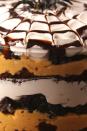 <p>Layers of pumpkin mousse, chocolate cake, and cool whip will please all holiday partygoers. </p><p>Get the recipe from <a href="https://www.delish.com/cooking/recipe-ideas/recipes/a55954/spider-trifle-recipe/" rel="nofollow noopener" target="_blank" data-ylk="slk:Delish;elm:context_link;itc:0;sec:content-canvas" class="link ">Delish</a>.</p>