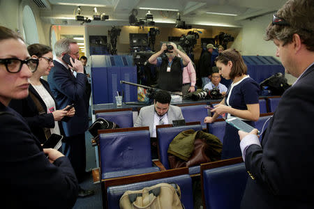 Journalists work in the briefing room at the White House in Washington, U.S., February 24, 2017. REUTERS/Yuri Gripas