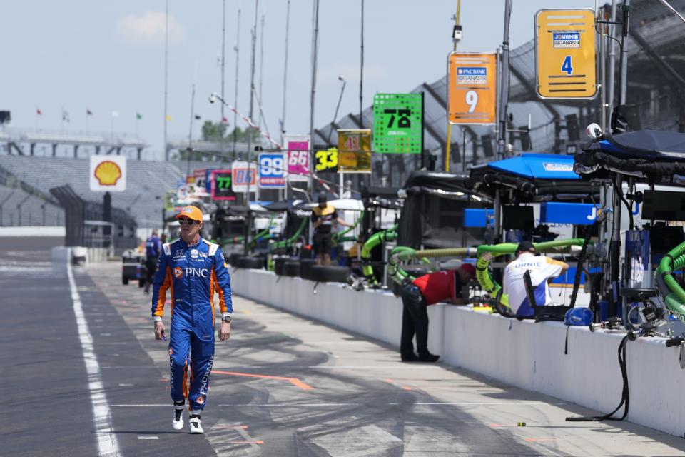 Scott Dixon, of New Zealand, walks down pit lane before a practice session for the Indianapolis 500 auto race at Indianapolis Motor Speedway, Monday, May 20, 2024, in Indianapolis. (AP Photo/Darron Cummings)