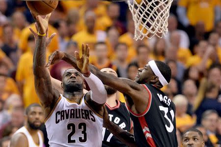 May 25, 2016; Cleveland, OH, USA; Cleveland Cavaliers forward LeBron James (23) drives to the basket as Toronto Raptors forward Terrence Ross (31) defends during the third quarter in game five of the Eastern conference finals of the NBA Playoffs at Quicken Loans Arena. The Cavs won 116-78. Mandatory Credit: Ken Blaze-USA TODAY Sports