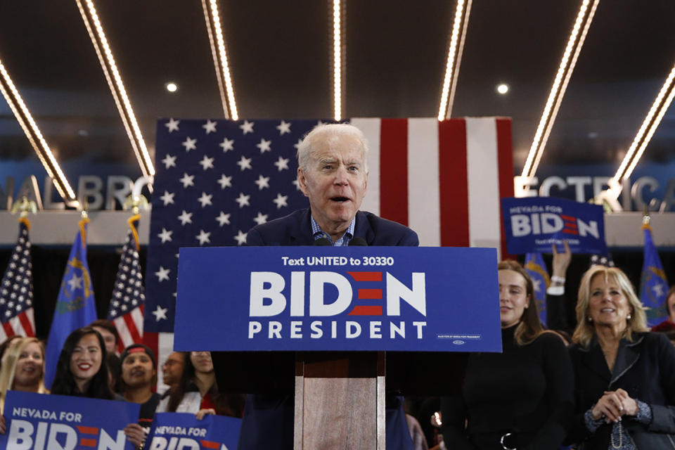 Democratic presidential candidate former Vice President Joe Biden, joined by his wife Jill Biden, right, and granddaughter Finnegan Biden, second from right, speaks during a caucus night event Saturday, Feb. 22, 2020, in Las Vegas. (AP Photo/John Locher)