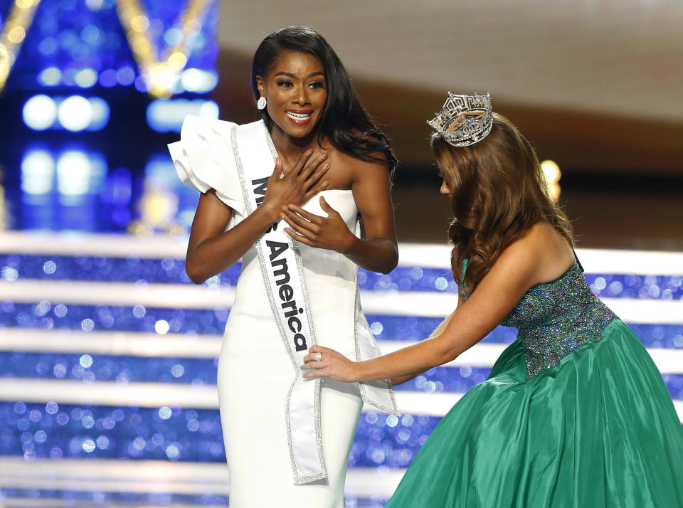 Miss New York Nia Franklin reacts after being named Miss America 2019, as she is crowned by last year's winner Cara Mund, Sunday, Sept. 9, 2018, in Atlantic City, N.J. (AP Photo/Noah K. Murray)