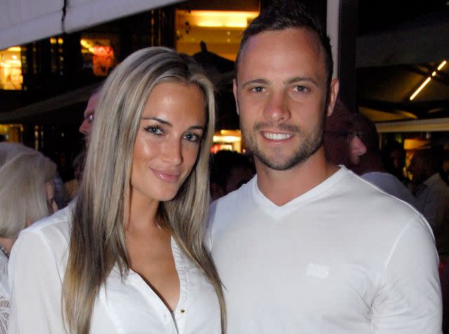 <p>Waldo Swiegers/Heat Magazine/Gallo Images/Getty</p> Oscar Pistorius and Reeva Steenkamp at the Tasha's All White Party on January 26, 2012 in Johannesburg, South Africa.