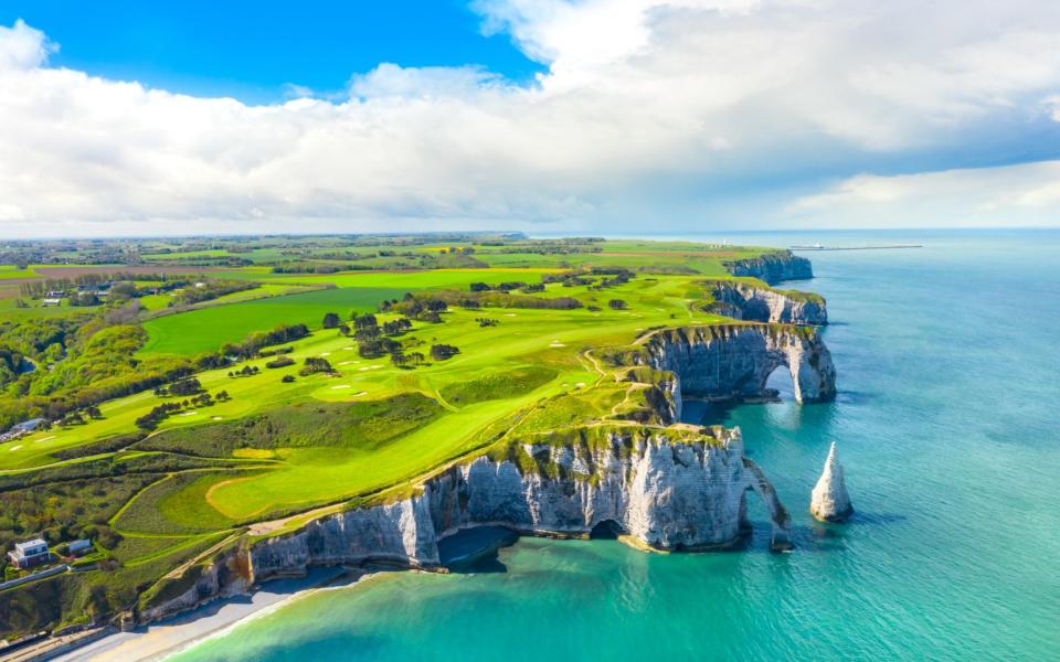 The coastline at Etretat in Normandy is worth seeing - istock