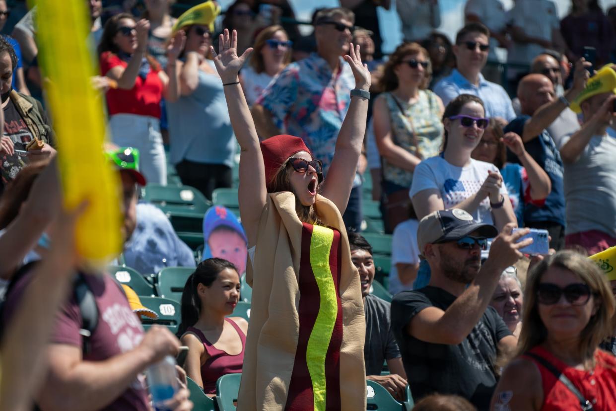 Spectators cheer at Maimonides Park for the 2021 Nathan's Famous 4th Of July International Hot Dog Eating Contest at Coney Island on July 4, 2021, in New York City.