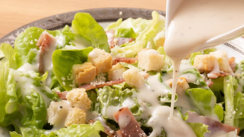 Caesar salad topped with dressing