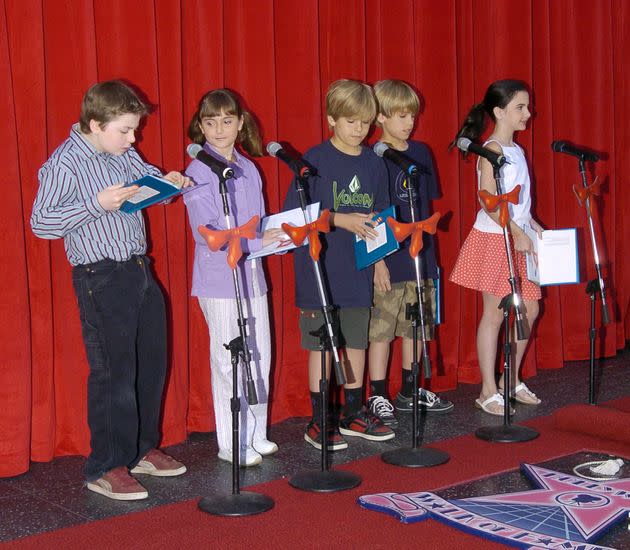 Alyson Stoner (second from left) and Dylan and Cole Sprouse (center and second from right) are seen with other child actors on the Hollywood Walk of Fame in 2004.