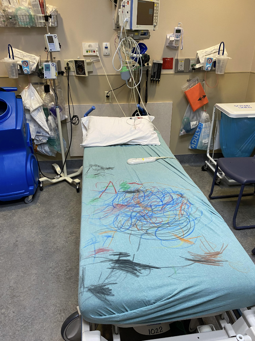 Kid's drawings on a hospital bed