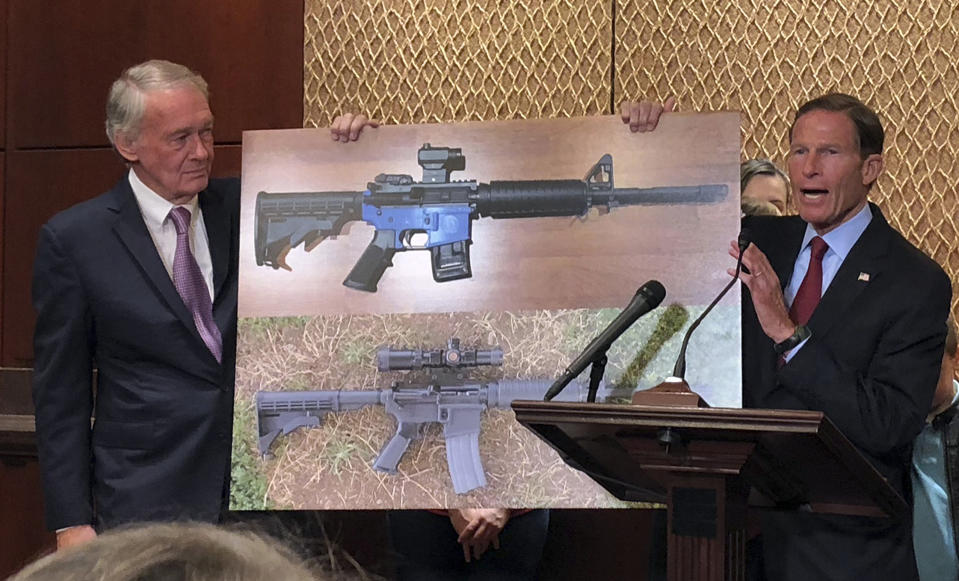 Sen. Edward Markey, D-Mass., left, and Sen. Richard Blumenthal, D-Ct., display a photo of a plastic gun on Tuesday, July 31, 2018, on Capitol Hill in Washington. Democrats are calling on President Donald Trump to reverse an administration decision to allow a Texas company to make blueprints for a 3D-printed gun available online. (AP Photo/Matthew Daly)