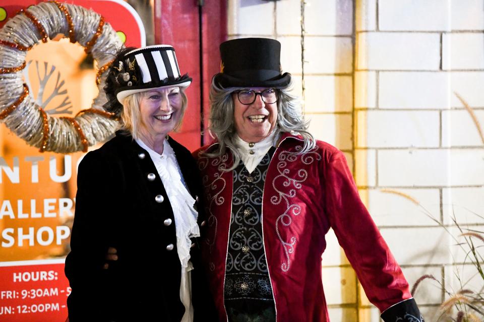 Dec 6, 2022; Tuscaloosa, Alabama, USA;  Northport hosted the annual Dickens Downtown on Main Ave. Tuesday, kicking off the Christmas season. Amy Echols and Mike Henderson wear Victorian costume as they pose for a photo outside the Kentuck  Art Center.