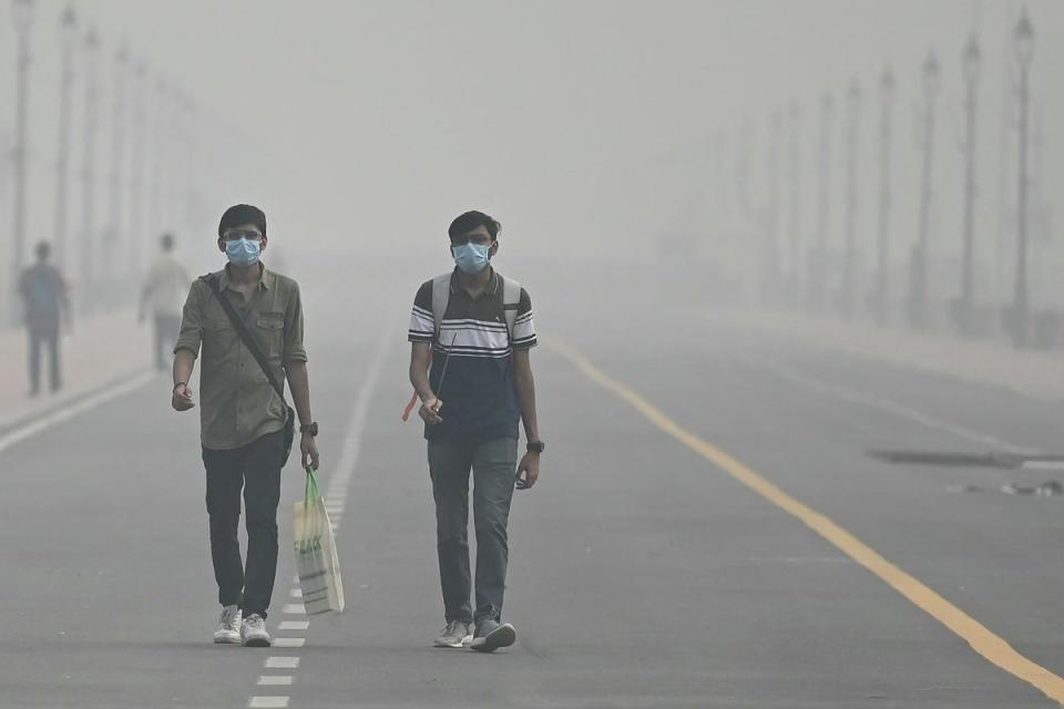 People have resorted to wearing masks due to the heavy pollution in Delhi over the past week (AFP via Getty Images)