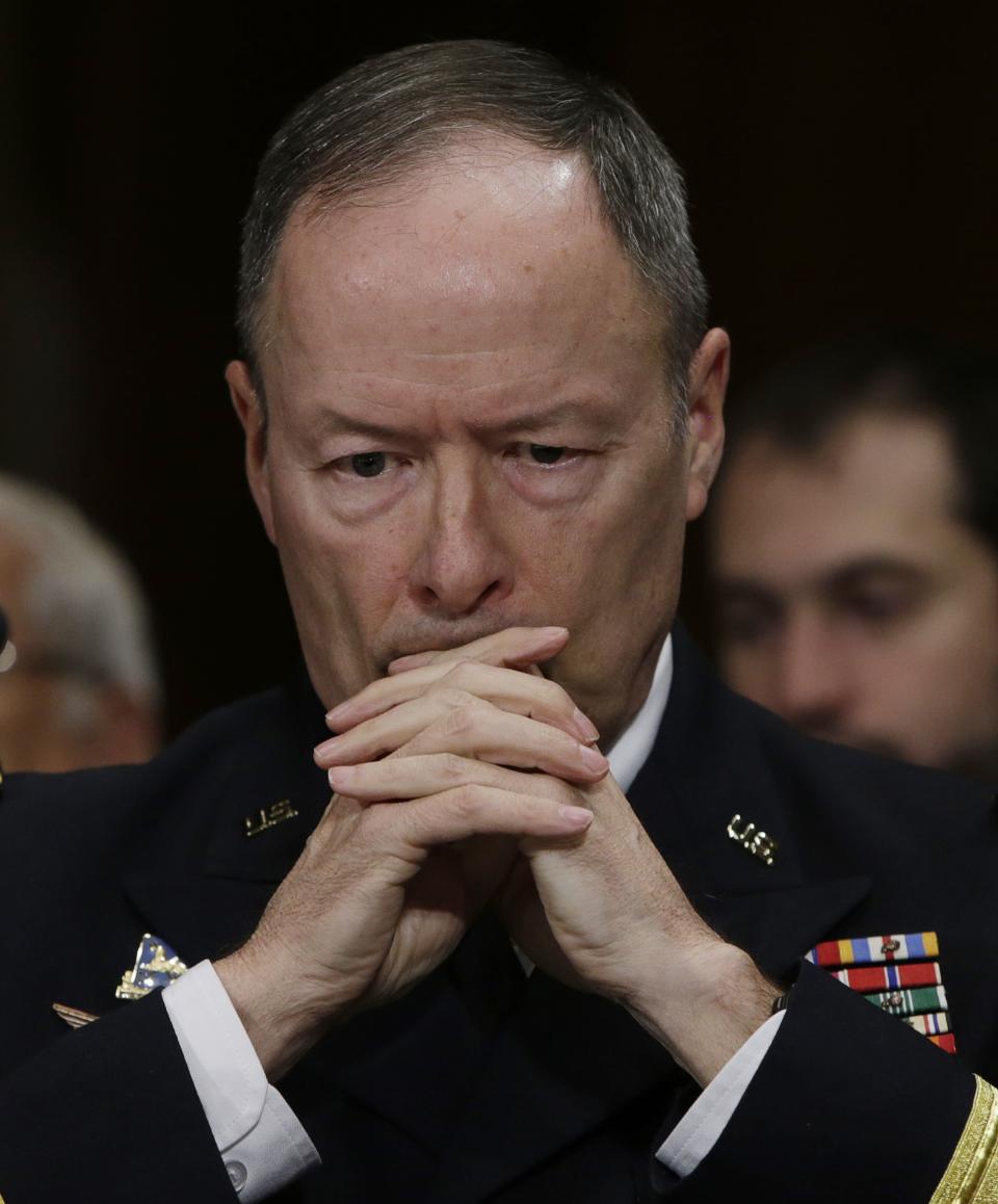 U.S. NSA Director General Alexander ponders a question while testifying before the Senate Judiciary Committee in Washington