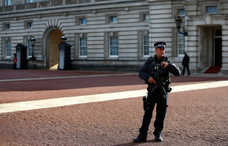 Armed police patrol the grounds of Buckingham Palace after a man was arrested at the visitor entrance of Britain's Queen Elizabeth's residence in London, Britain, September 23, 2018. REUTERS/Henry Nicholls