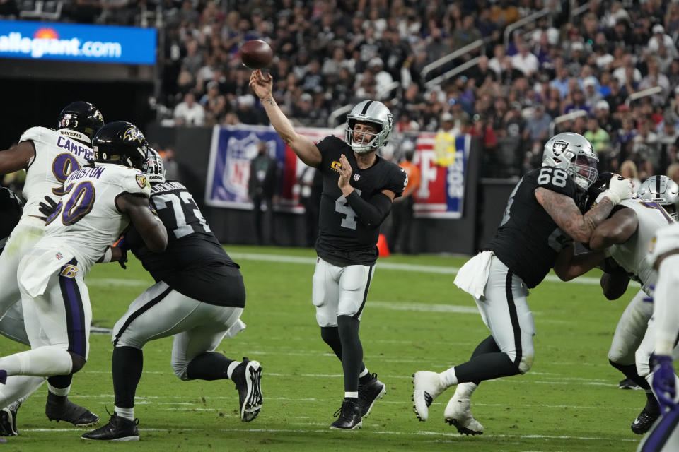 Las Vegas Raiders quarterback Derek Carr (4) throws against the Baltimore Ravens during the first half of an NFL football game, Monday, Sept. 13, 2021, in Las Vegas. (AP Photo/Rick Scuteri)