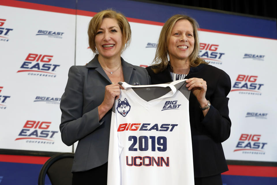 Susan Herbst, left, President, University of Connecticut, and Big East Commissioner Val Ackerman, pose for photos at the announcement that the University of Connecticut is re-joining the Big East Conference, at New York's Madison Square Garden, Thursday, June 27, 2019. (AP Photo/Richard Drew)