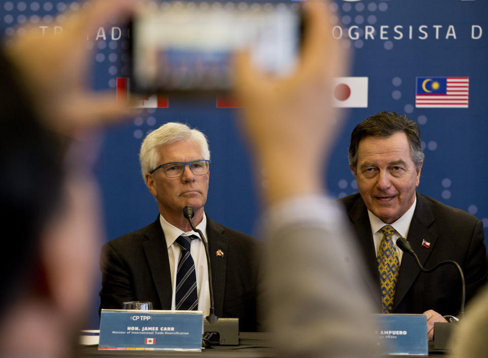 Chilean Foreign Minister Fernando Ampuero, talks next to James Carr, Minister of International Trade Diversification of Canada during a meeting of the Comprehensive and Progressive Agreement for Trans-Pacific Partnership, CP TPP, in Santiago, Chile, Thursday, May 16, 2019. (AP Photo/Esteban Felix)