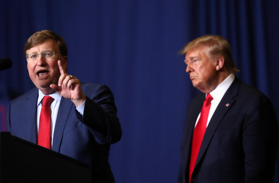 President Donald Trump stands beside Mississippi Gov. Tate Reeves (R).  (Photo: Leah Millis / Reuters)