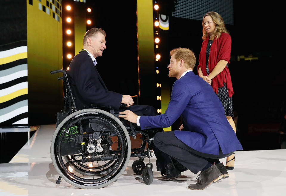 <p>Harry greeted Captain Trevor Greene at the opening ceremonies on Sept. 23. "The way he talks and the body language and the way he acts, you can see the passion that he has for all of this," says another veteran, Richard Hobson. "What he brings to this is such a big spotlight on a huge issue. I've been in the army for ten years and never heard of it until I met [my wife] two years ago."</p>