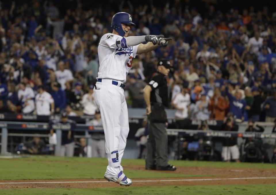 Joc Pederson celebrates after hitting a home run during the seventh inning of Game 6 of baseball’s World Series against the Houston Astros Tuesday, Oct. 31, 2017, in Los Angeles. (AP Photo)