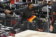 Utah Jazz guard Donovan Mitchell reacts in the bench area during the second half of the team's NBA basketball game against the Atlanta Hawks on Friday, Jan. 15, 2021, in Salt Lake City. (AP Photo/Rick Bowmer)