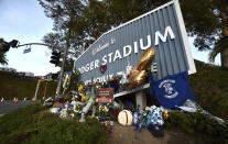 A makeshift memorial along Vin Scully Way in front of Dodger Stadium in Los Angeles on Wednesday, Jan. 13, 2021, honors former Los Angeles Dodgers manager Tommy Lasorda, who died last week. (Keith Birmingham/The Orange County Register via AP)