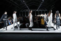 Models wear creation as part of the Ermanno Scervino women's Fall Winter 2020-21 collection, unveiled during the Fashion Week in Milan, Italy, Saturday, Feb. 22, 2020. (AP Photo/Antonio Calanni)