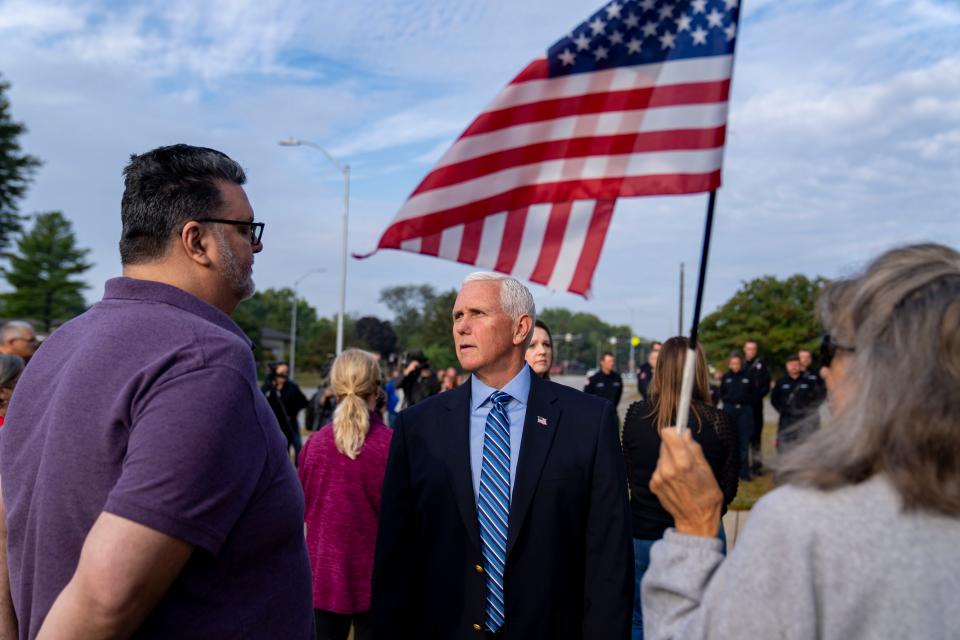 Republican presidential candidate former Vice President Mike Pence talks with attendees during a 9/11 remembrance ceremony at the Ankeny Fire Department, Monday, Sept. 11, 2023.