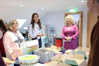 <p>Children are helped through art therapy, and Prince William and Kate joined with volunteers to put together the charity's "Little Boxes of Hope" care packages.</p>