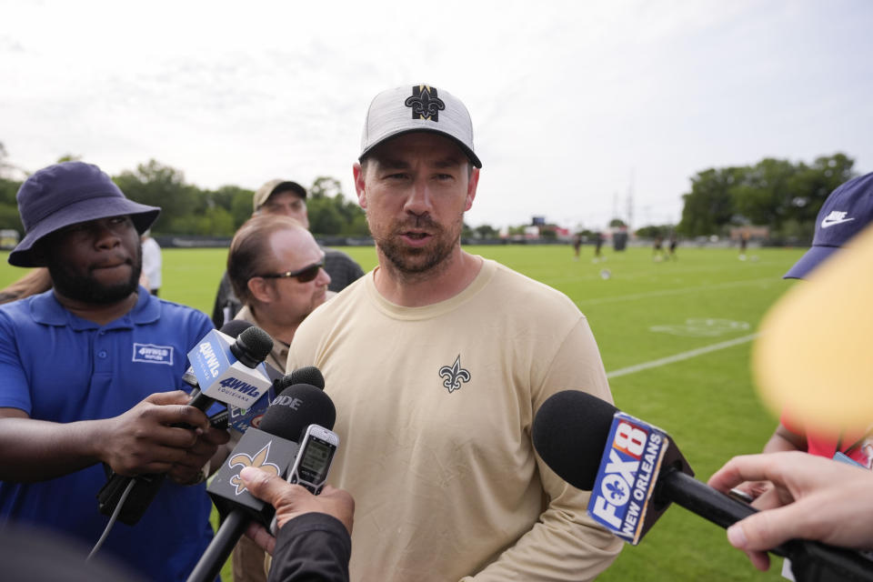 New Orleans Saints offensive coordinator Clint Kubiak talks to reporters after an NFL rookie minicamp football practice in Metairie, La., Saturday, May 11, 2024. (AP Photo/Gerald Herbert)