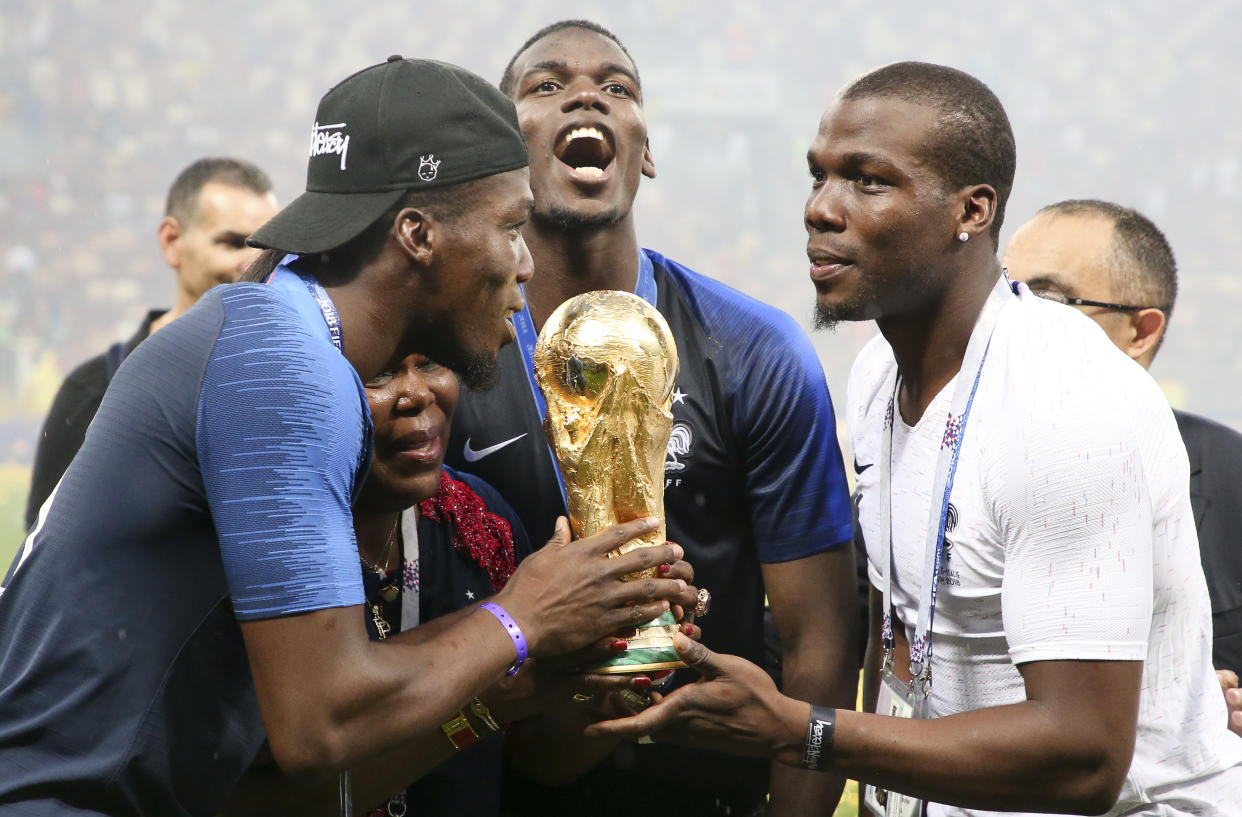 MOSCOW, RUSSIA - JULY 15: Paul Pogba of France celebrates the victory with his mother Yeo Pogba and his brothers Florentin Pogba, Mathias Pogba following the 2018 FIFA World Cup Russia Final between France and Croatia at Luzhniki Stadium on July 15, 2018 in Moscow, Russia. (Photo by Jean Catuffe/Getty Images)