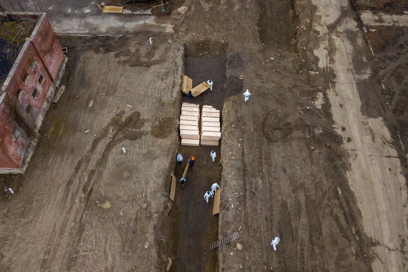 FILE PHOTO: Drone pictures show bodies being buried on New York's Hart Island amid the coronavirus disease (COVID-19) outbreak in New York City