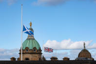 <p>The flag of Scotland, (the Saltire) and a Union Jack fly at half mast following the death of Britain's Queen Elizabeth II before her coffin arrives at St. Giles' Cathedral on September 12, 2022 in Edinburgh, Scotland. (Photo by Russell Cheyne-WPA Pool/Getty Images)</p> 